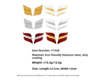 Detail of colorful angel wing earrings in titanium steel with 18k gold plating