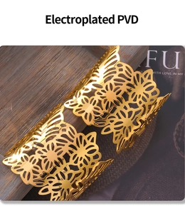 Macro shot of 18k gold plated stainless steel bracelet with cutout floral patterns