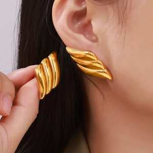 Abstract winged gold stud earrings with 18k gold plating for a luxury fashion look
