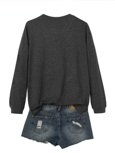 Rear view of grey sweatshirt with STRONGER text and distressed denim shorts on white background