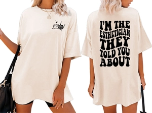 Front and back detail of oversized beige T-shirt with black Esthetician text and star design