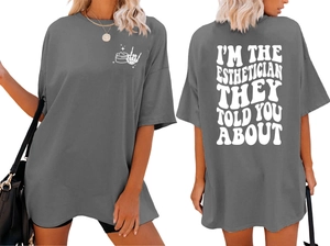 Front and back detail of charcoal oversized t-shirt with esthetician graphic and slogan