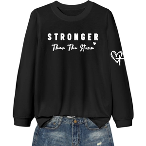 Black sweatshirt with Stronger Than The Storm print and cross heart detail on sleeve