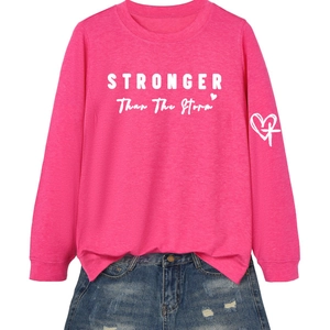 Hot pink crewneck sweatshirt featuring white STRONGER THAN THE STORM lettering and icons