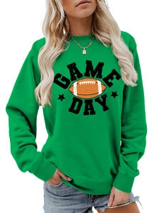 Close-up of vibrant green Game Day sweatshirt featuring football print and ribbed cuffs
