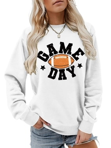 Detailed close-up of ribbed cuffs and Game Day football print on a white sweatshirt
