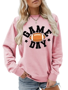 Close-up of pink Game Day sweatshirt showing football print and fabric texture