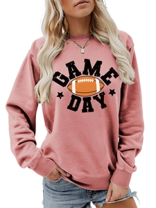 Close-up of GAME DAY text and football print on dusty rose pink crewneck sweatshirt
