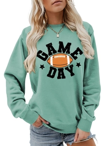Detail of mint green sweatshirt with Game Day text and orange football graphic