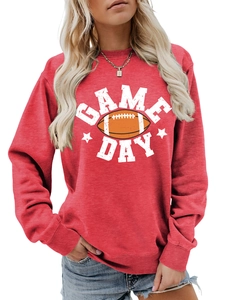 Close-up of Game Day football print on bright red crewneck sweatshirt fabric