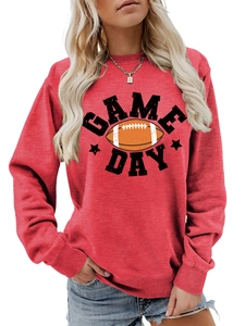 Detail of red crewneck sweatshirt with Game Day football graphic and ribbed cuffs
