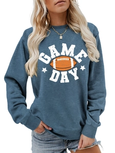 Close-up of ribbed crewneck and Game Day football print on blue sweatshirt