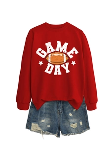 Detail showing red Game Day sweatshirt and distressed blue denim shorts flat lay