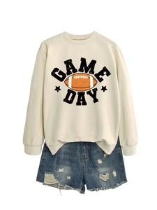 Detail of Game Day graphic sweatshirt with retro football print and distressed denim shorts