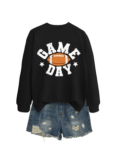 Detail of black Game Day sweatshirt with football print and distressed blue denim shorts