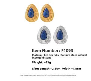 Detail of drop-shaped lapis lazuli earrings in gold and silver plated titanium steel