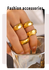 Detail of 18k gold plated geometric stackable rings with hammered texture design