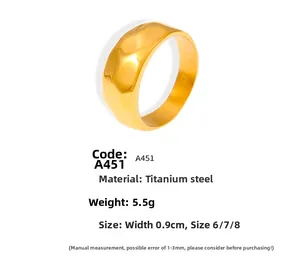 Macro shot of 18k gold plated titanium steel ring with irregular hammered texture detail