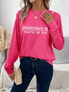 Detail of bright pink long sleeve tee with white Underestimate Me That'll Be Fun text