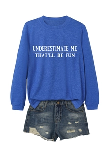 Detail of royal blue sweatshirt with white text and distressed denim shorts