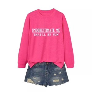 Pink long sleeve t-shirt with 'Underestimate Me' slogan and ripped denim shorts outfit