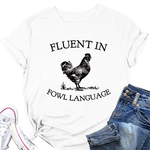 Flat lay of white cotton T-shirt featuring 'Fluent in Fowl Language' rooster graphic print