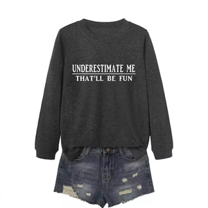 Grey sweatshirt with Underestimate Me lettering and ripped denim shorts outfit set