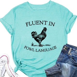 Detail of light blue T-shirt with black rooster print and fluent in fowl language text