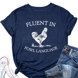 Detail of navy blue t-shirt with white rooster print and fluent in fowl language text