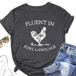 Flat lay of charcoal grey t-shirt with Fowl Language print and casual accessories