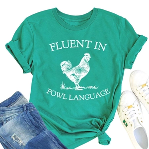 Flat lay of teal cotton T-shirt with rooster print and blue distressed denim jeans