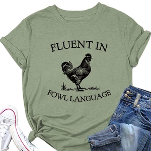 Detail of sage green cotton T-shirt featuring a rooster print and funny English slogan