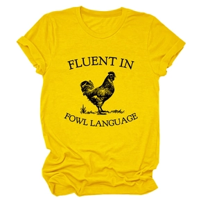Detail of yellow cotton t-shirt with black rooster print and fluent in fowl language text