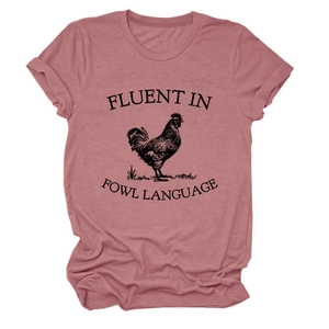 Close-up of pink crew neck t-shirt featuring a vintage rooster print and fowl language text