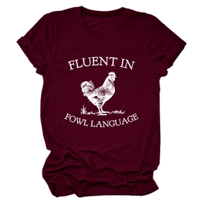 Detail of burgundy cotton T-shirt featuring white rooster print and witty fowl text