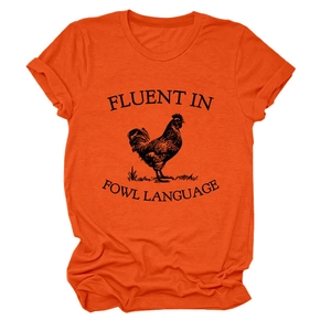 Detail of the high-quality orange cotton t-shirt with a black rooster and fowl text