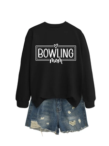 Detail of black bowling mom sweatshirt paired with frayed denim shorts for casual style