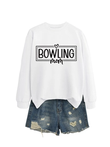 Detailed flat lay of white bowling mom sweatshirt with blue distressed denim shorts