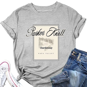 Flat lay of gray Parker Knoll 1993 T-shirt styled with denim shorts and white sneakers
