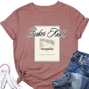 Flat lay of pink Parker Knoll printed T-shirt with casual jeans and canvas sneakers