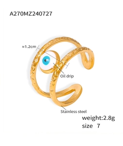 Detail of gold evil eye ring showing size 7 dimensions and oil drip craft texture