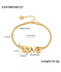 Detailed view of gold stainless steel LOVE bracelet with sparkling rhinestone inlay