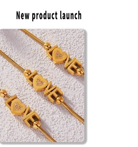 Detail of 18K gold-plated LOVE heart snake chain bracelets with sparkling zircon stones