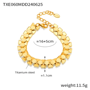 Detail of 18k gold plated titanium steel link bracelet showing textured geometric plates