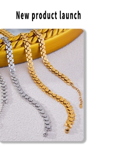 Macro shot of 18k gold and silver geometric interlocking link chain with matte texture
