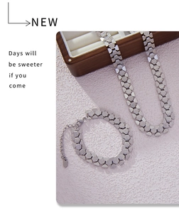 Detailed view of silver hexagonal gear link necklace and bracelet set in industrial style