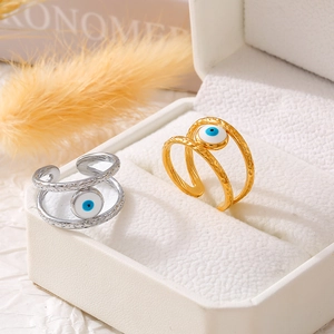 Adjustable evil eye ring set in gold and silver finish with hammered texture bands
