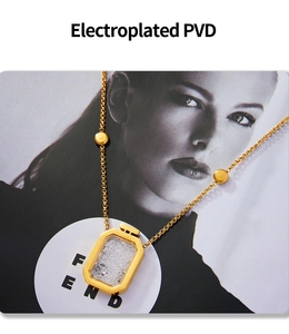 Detail of PVD plated gold square pendant with sparkling crystals and perfume bottle design