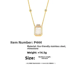 Detailed specs of gold perfume bottle pendant necklace with floating crystals inside