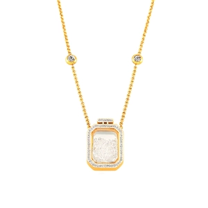 Golden necklace with a crystal-encrusted square perfume bottle pendant and floating stones
